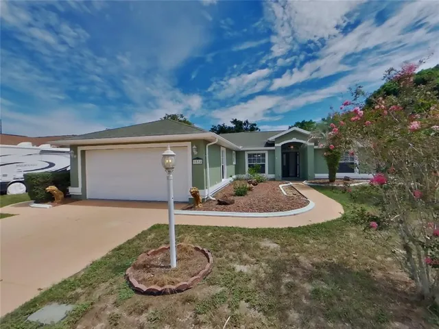 a big house with swimming pool in front of it