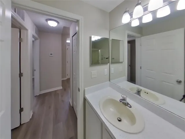a bathroom with a sink and a mirror