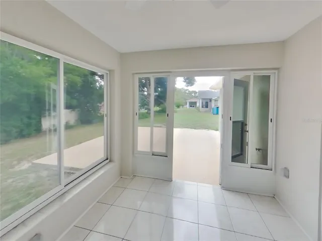 a view of a big room with windows and view of balcony