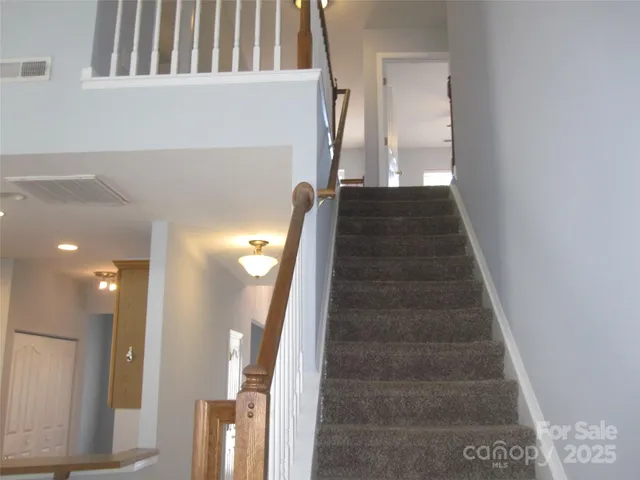 a view of a hallway with staircase