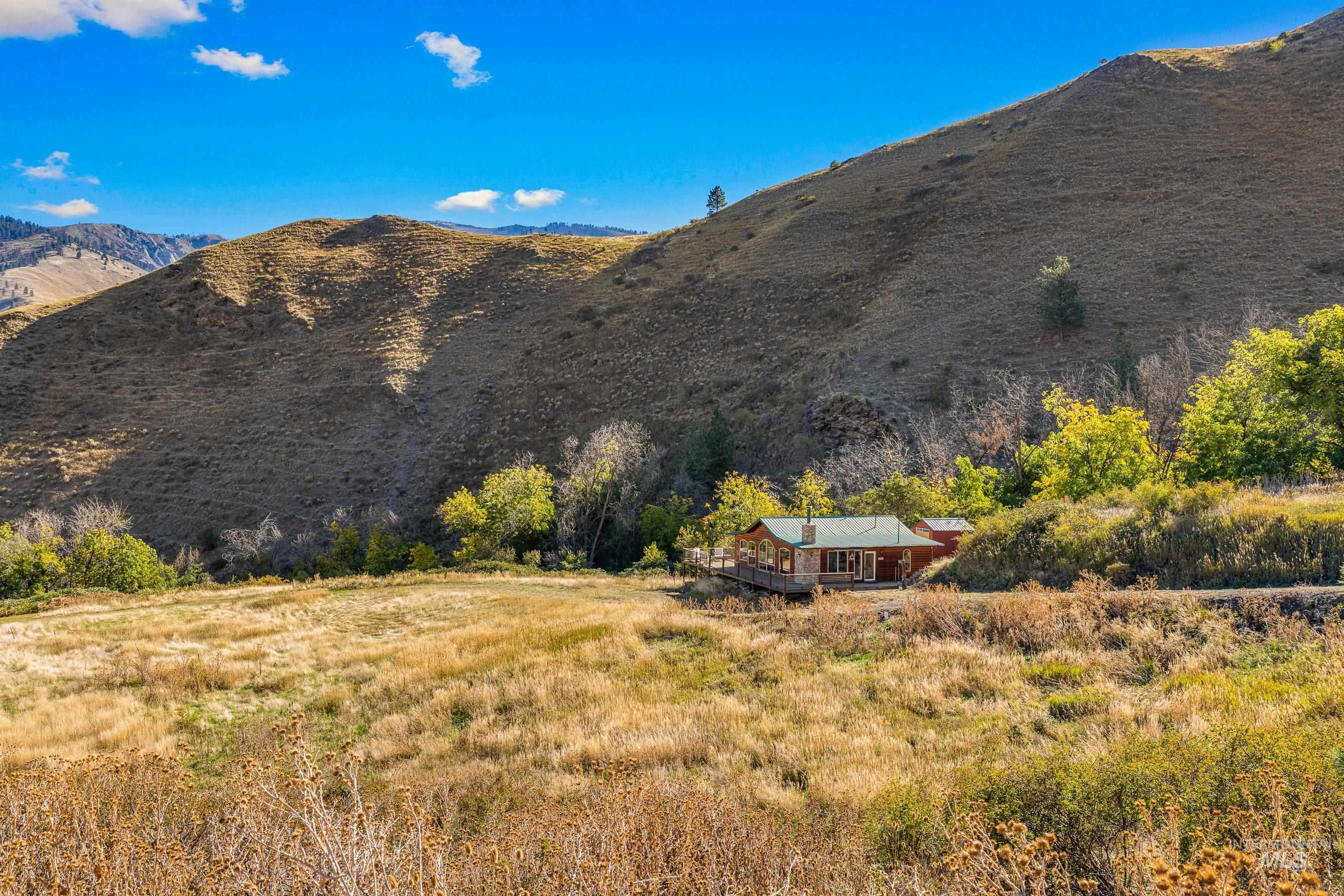 236 Seven U Ranch Road Lucile, ID 83542 - Photo 22 of 26 View of mountain backdrop with rural landscape