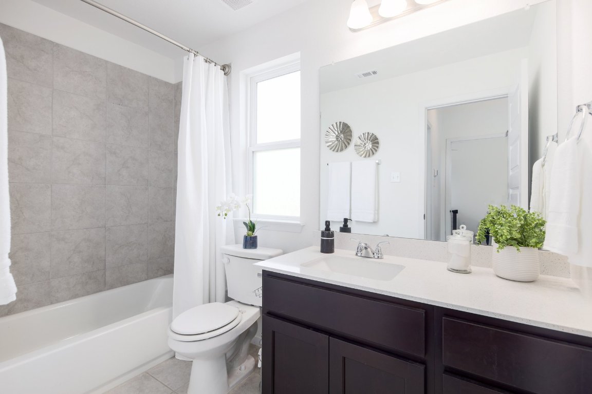 1408 Flint Knapper Drive Georgetown, TX 78626 - Photo 25 of 32 a bathroom with a sink and a mirror