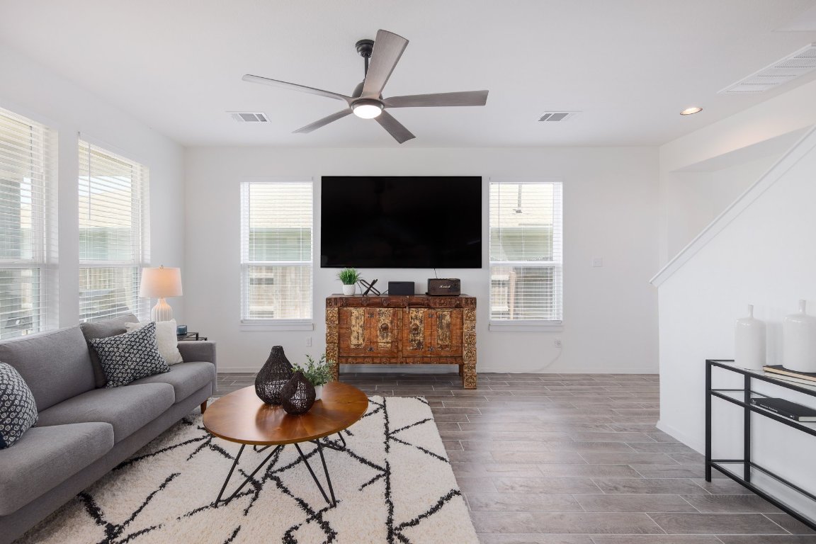1408 Flint Knapper Drive Georgetown, TX 78626 - Photo 5 of 32 a living room with furniture and a flat screen tv