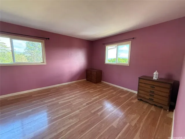 a bathroom with a granite countertop toilet and a sink