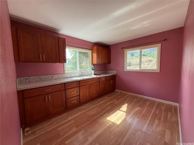 a workspace with furniture hardwood and a window