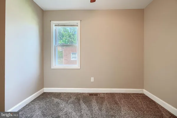 an empty room with window