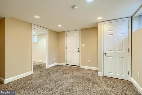a view of an empty room with stairs