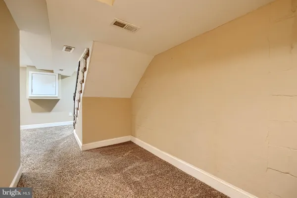 a view of washer and dryer with kitchen in the background