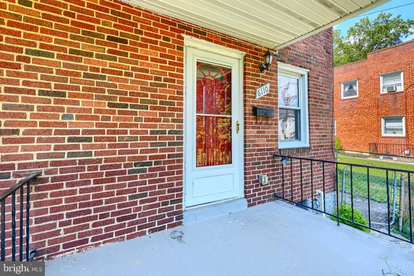 a view of front door of house with deck