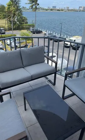 a view of a balcony with furniture