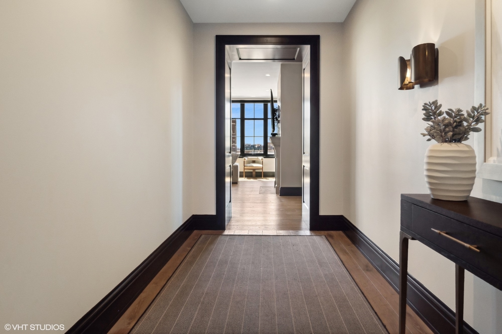1109 West Washington Boulevard, Unit 6D Chicago, IL 60607 - Photo 24 of 41 a view of a hallway with wooden floor and staircase