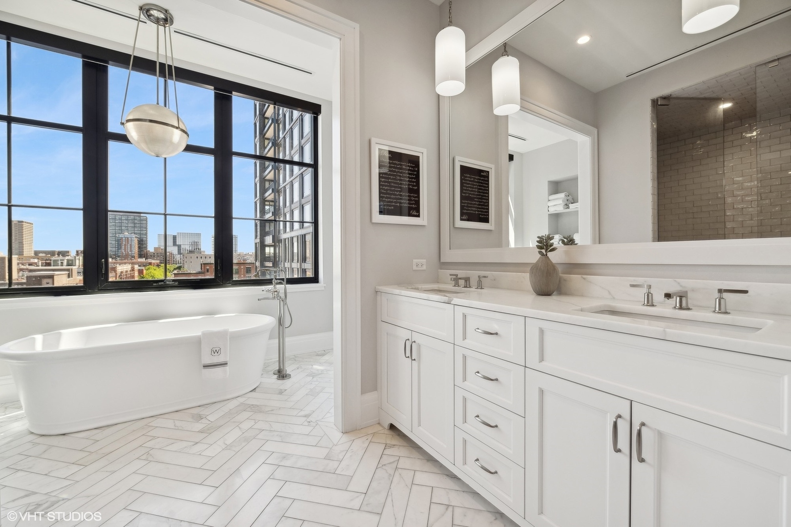 1109 West Washington Boulevard, Unit 6D Chicago, IL 60607 - Photo 31 of 41 a bathroom with a tub sink and mirror