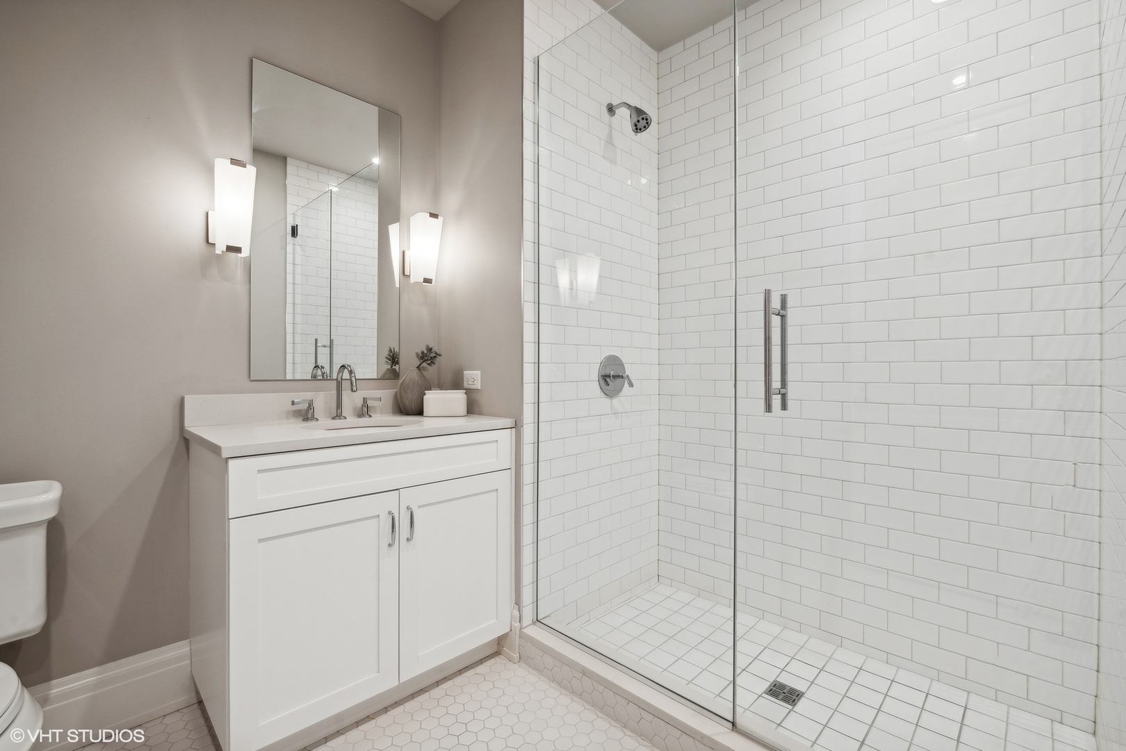 1109 West Washington Boulevard, Unit 6D Chicago, IL 60607 - Photo 39 of 41 a bathroom with a shower sink and mirror