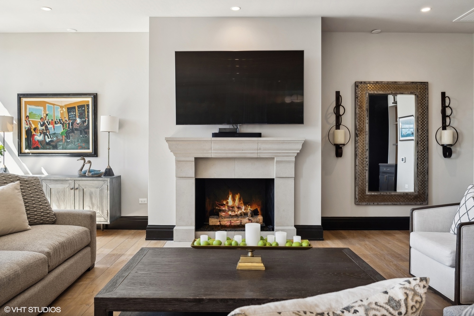 1109 West Washington Boulevard, Unit 6D Chicago, IL 60607 - Photo 7 of 41 a living room with furniture a flat screen tv and a fireplace