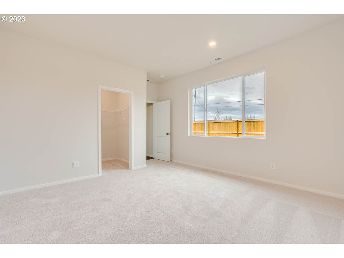 2655 26th Loop Springfield, OR 97477 - Photo 12 of 20 a view of an empty room with a window