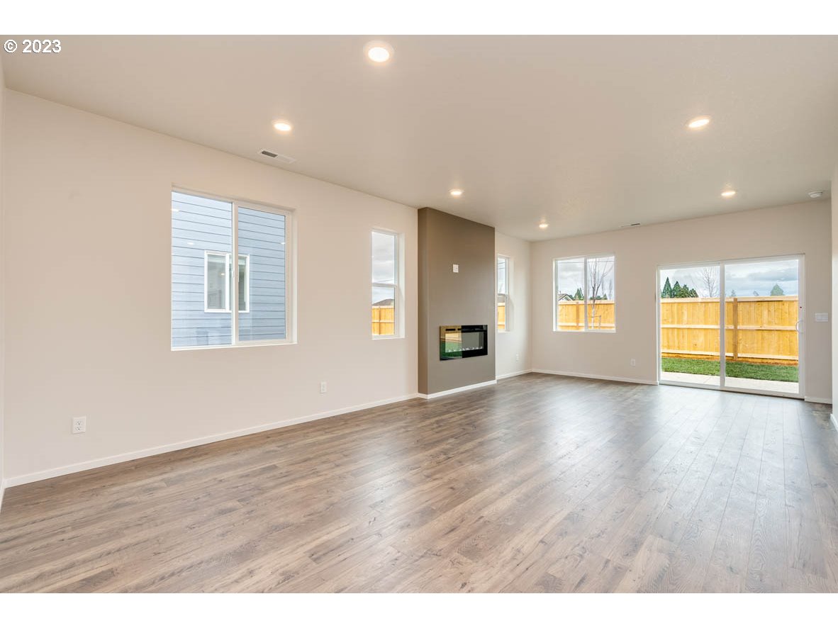 2655 26th Loop Springfield, OR 97477 - Photo 5 of 20 a view of an empty room with window and wooden floor