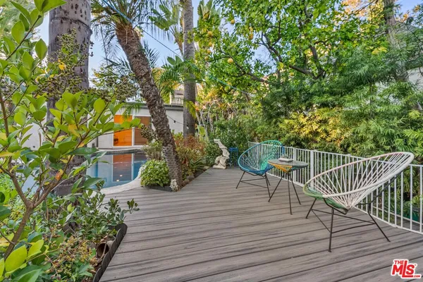 a view of a chairs and table on the wooden floor