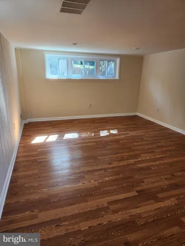 a view of room and hardwood floor