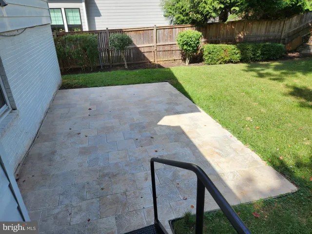 a view of backyard with seating space