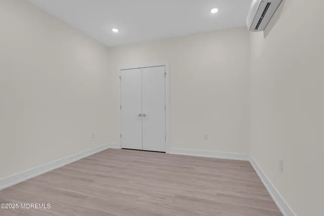 a view of room with wooden floor