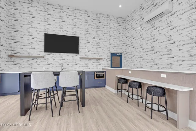 a dinning room with furniture and wooden floor