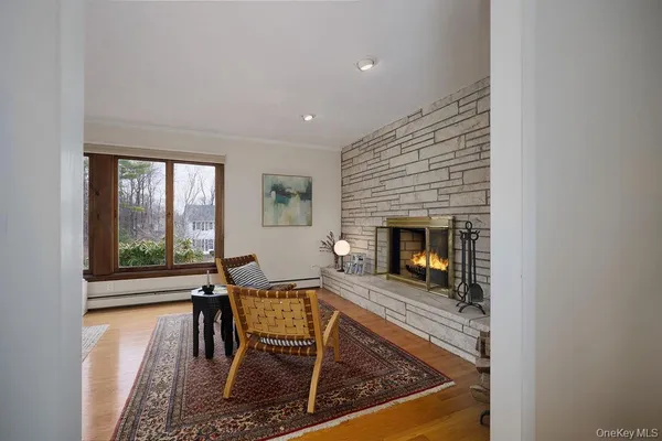 a dining room with furniture and wooden floor