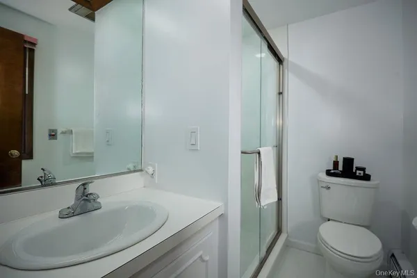 a living room with furniture and a air conditioner vent
