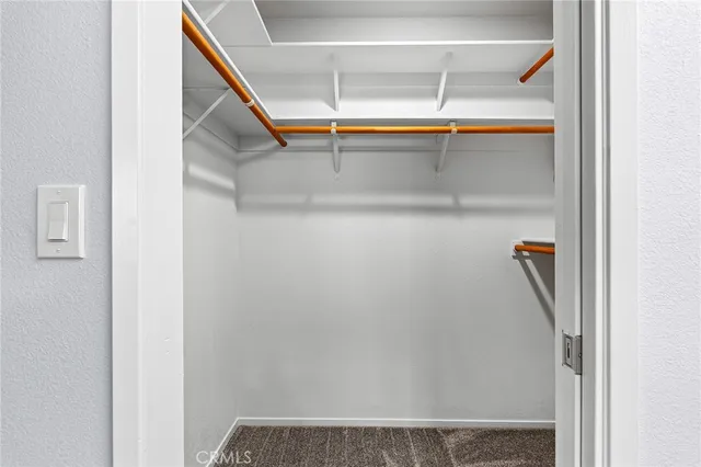 a view of storage and utility room with granite countertop cabinets