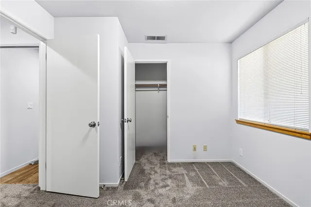 a view of a kitchen with a sink and cabinets