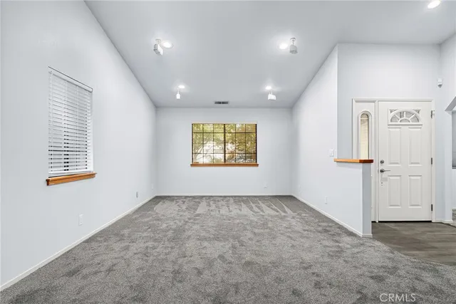 a view of an empty room with a window