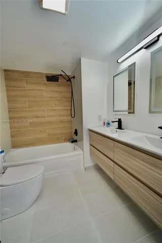 a bathroom with a bathtub and a sink