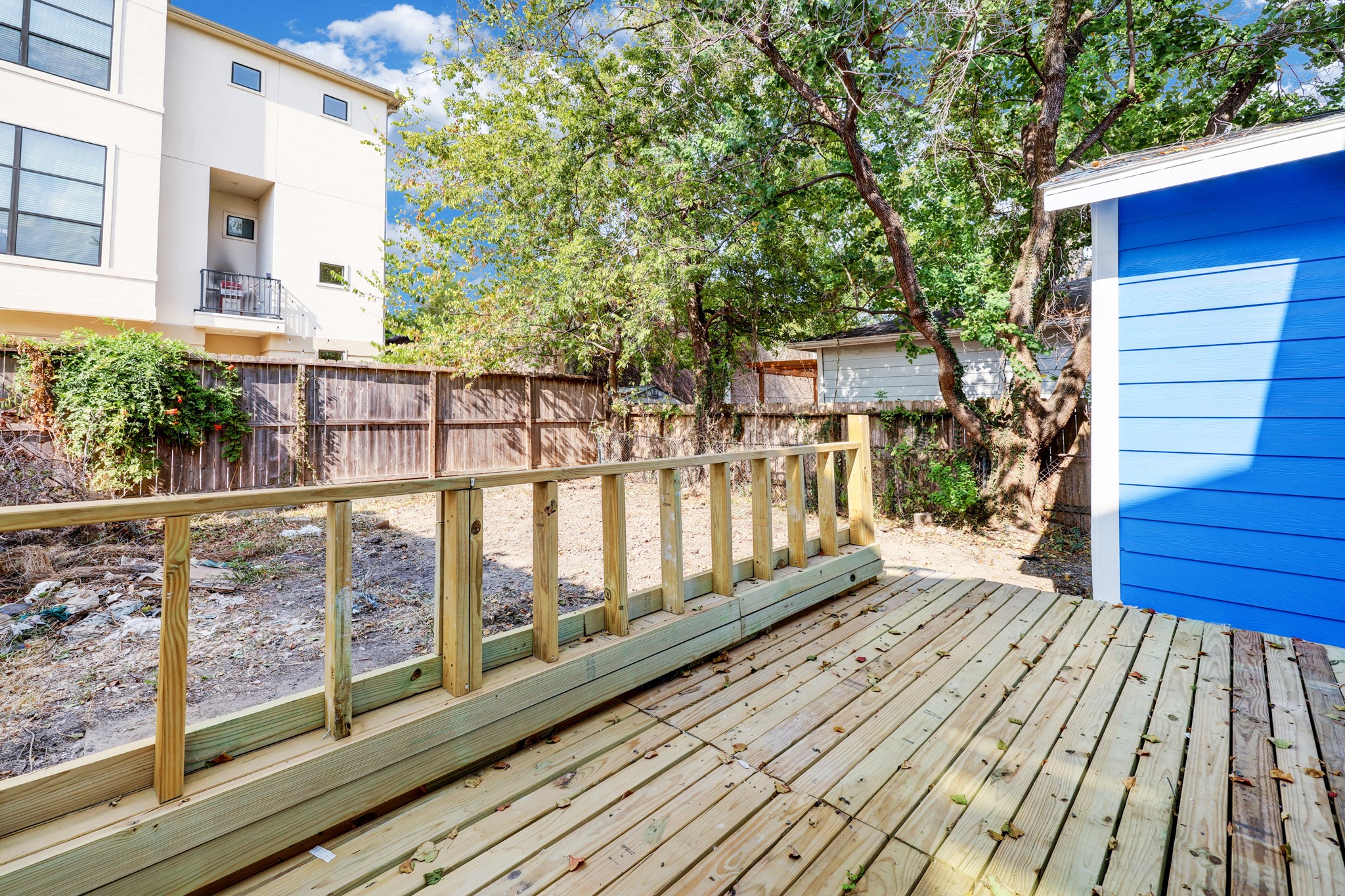 4224 Marina Street Houston, TX 77007 - Photo 12 of 13 a view of wooden balcony with a floor to ceiling window and wooden floor