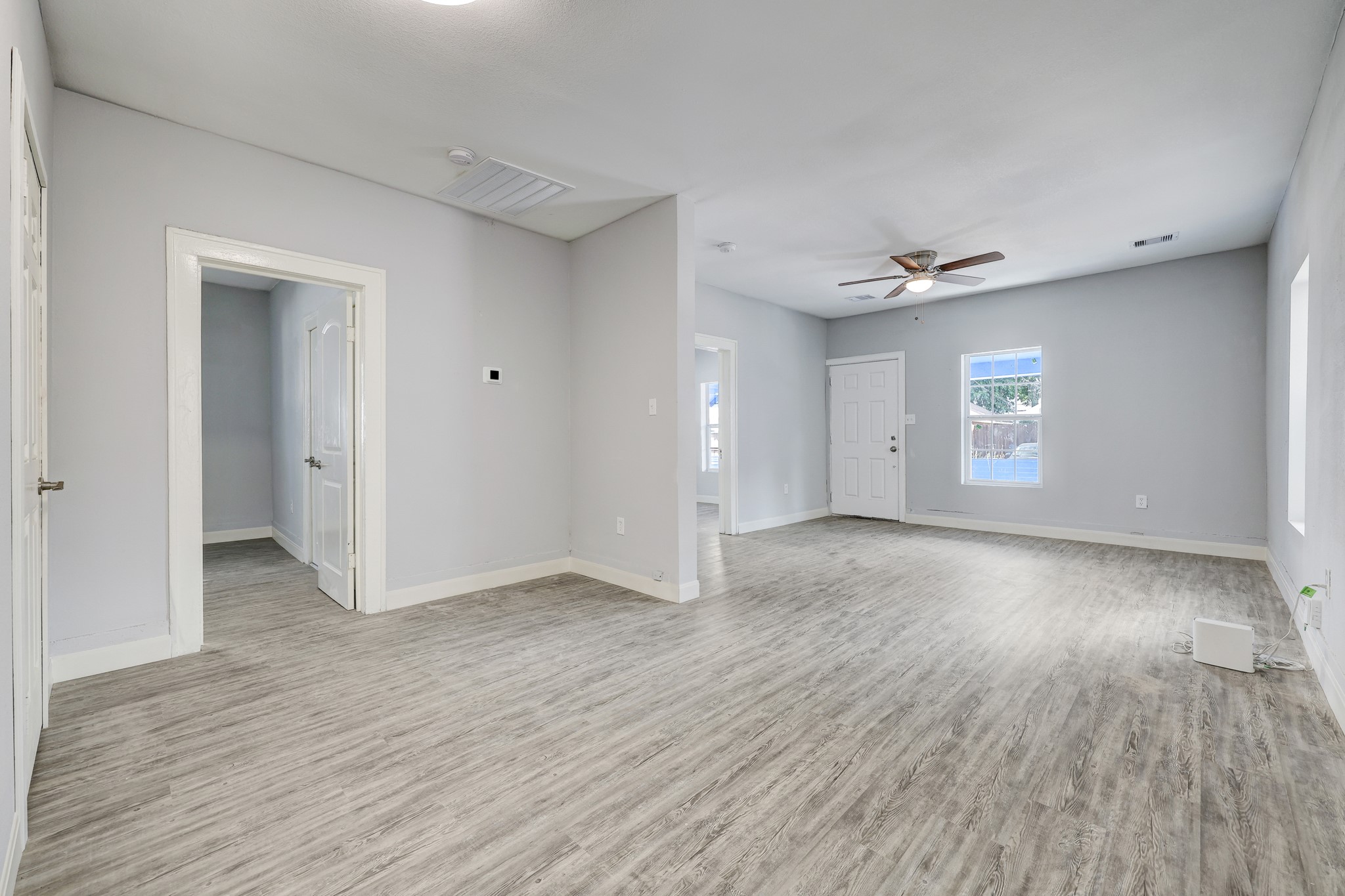 4224 Marina Street Houston, TX 77007 - Photo 3 of 13 a view of an empty room with window and wooden floor