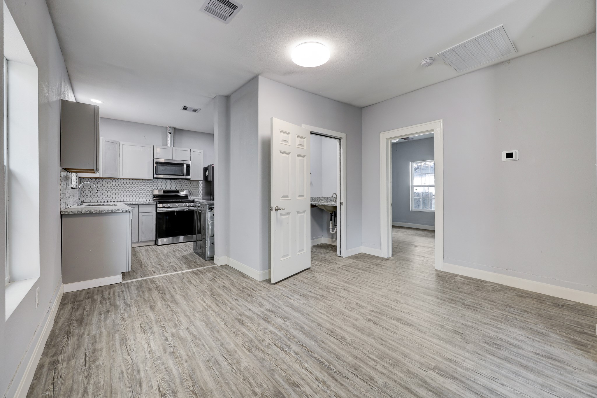 4224 Marina Street Houston, TX 77007 - Photo 5 of 13 a kitchen with stainless steel appliances a refrigerator and a stove top oven