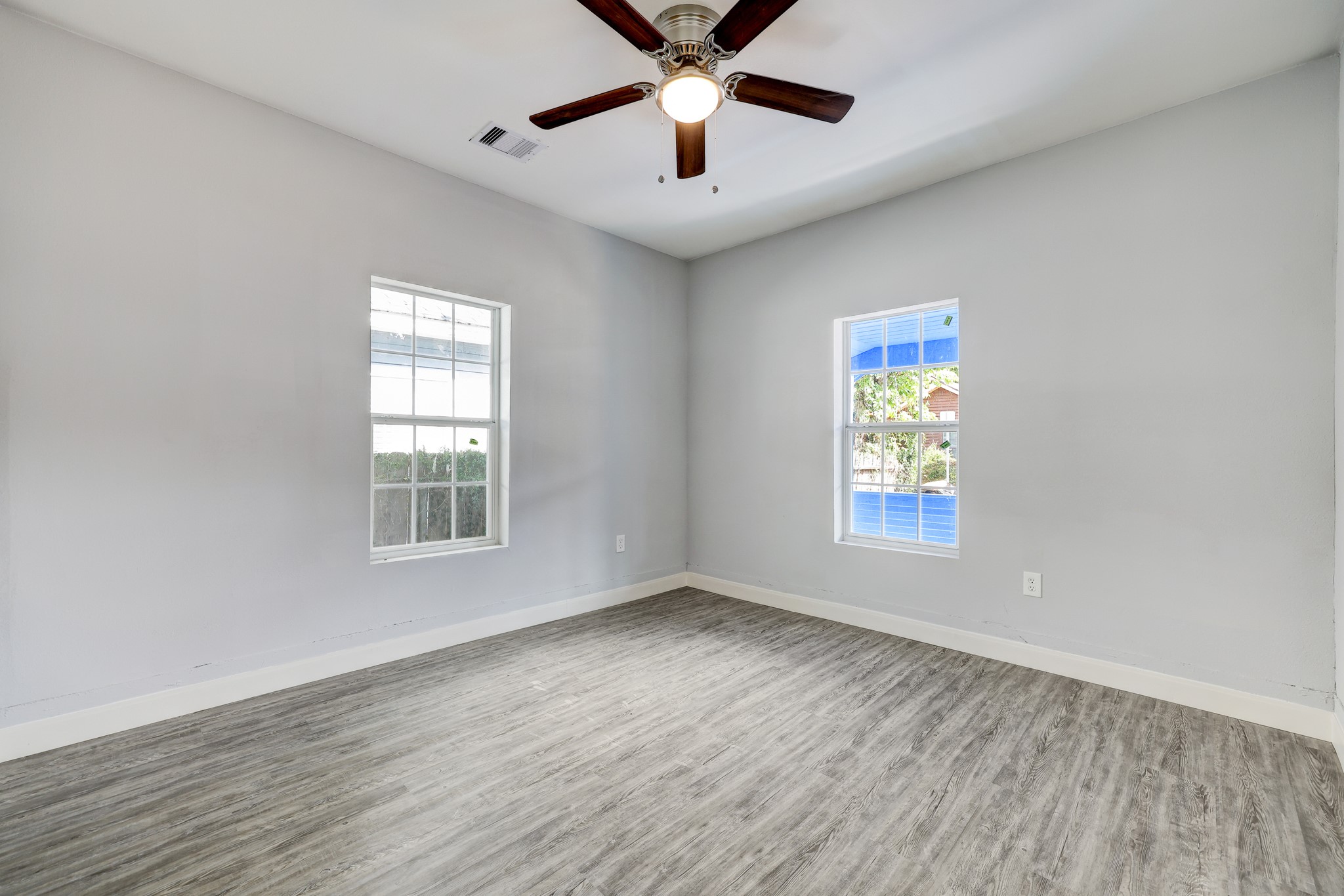 4224 Marina Street Houston, TX 77007 - Photo 10 of 13 wooden floor in an empty room with a window