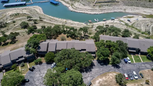 an aerial view of a house with outdoor space