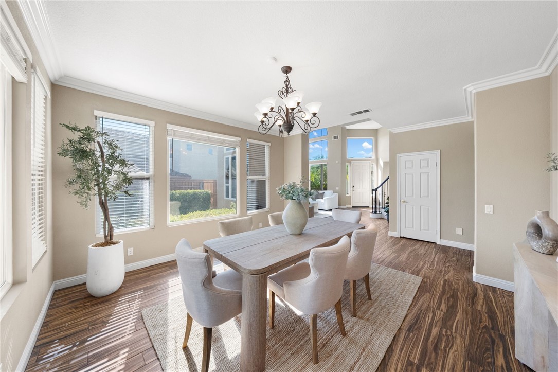 31465 Inverness Court Temecula, CA 92591 - Photo 16 of 75 Spacious formal dining room is enhanced by abundant natural light and an open, sophisticated atmosphere | Professionally Staged