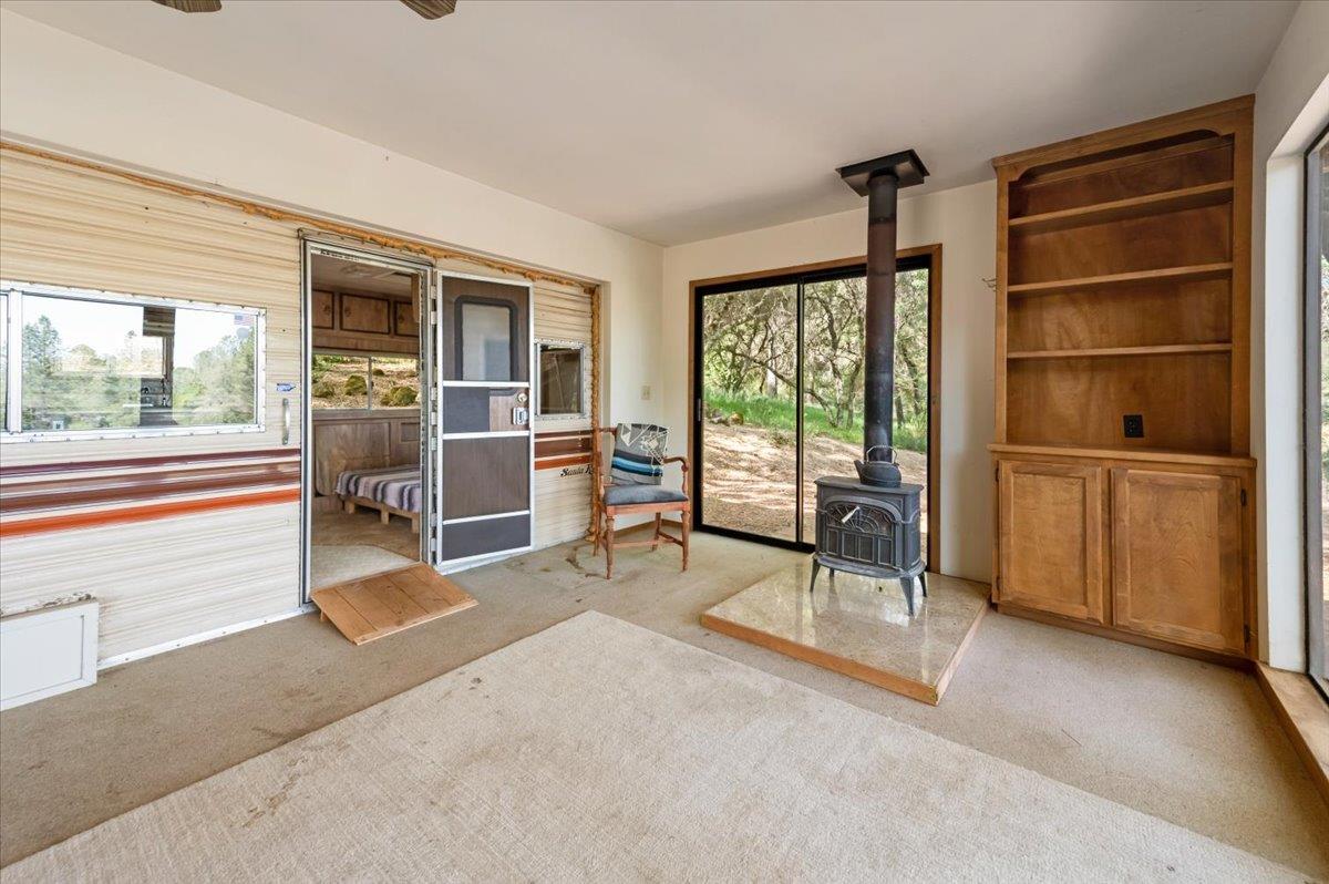 11076 Houghton Ranch Road Penn Valley, CA 95946 - Photo 12 of 41 a living room with furniture and large windows