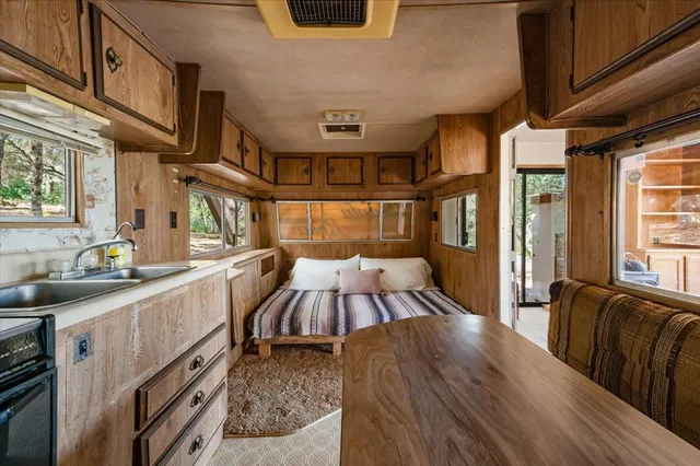 a view of a kitchen with furniture and a window