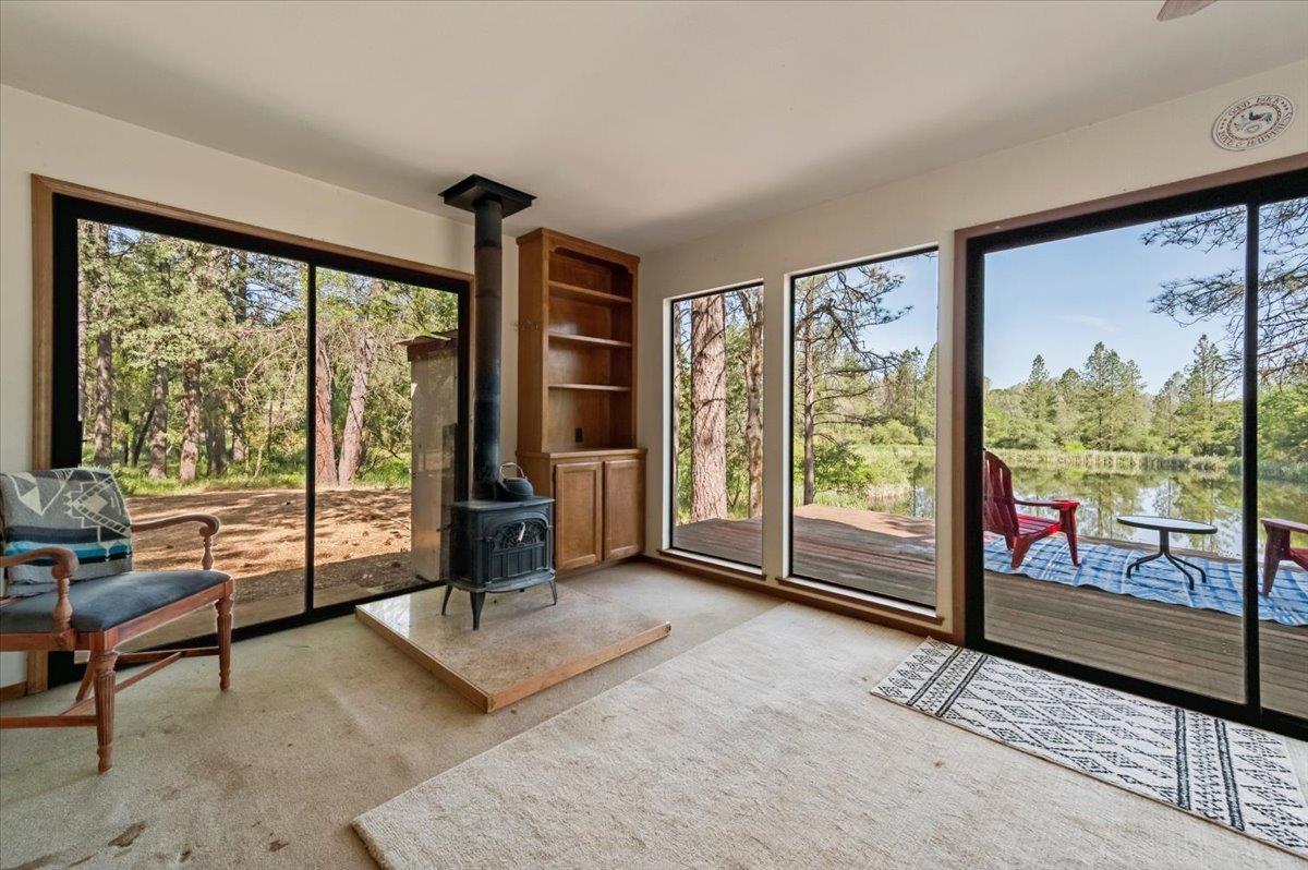 11076 Houghton Ranch Road Penn Valley, CA 95946 - Photo 17 of 41 a living room with furniture and large windows