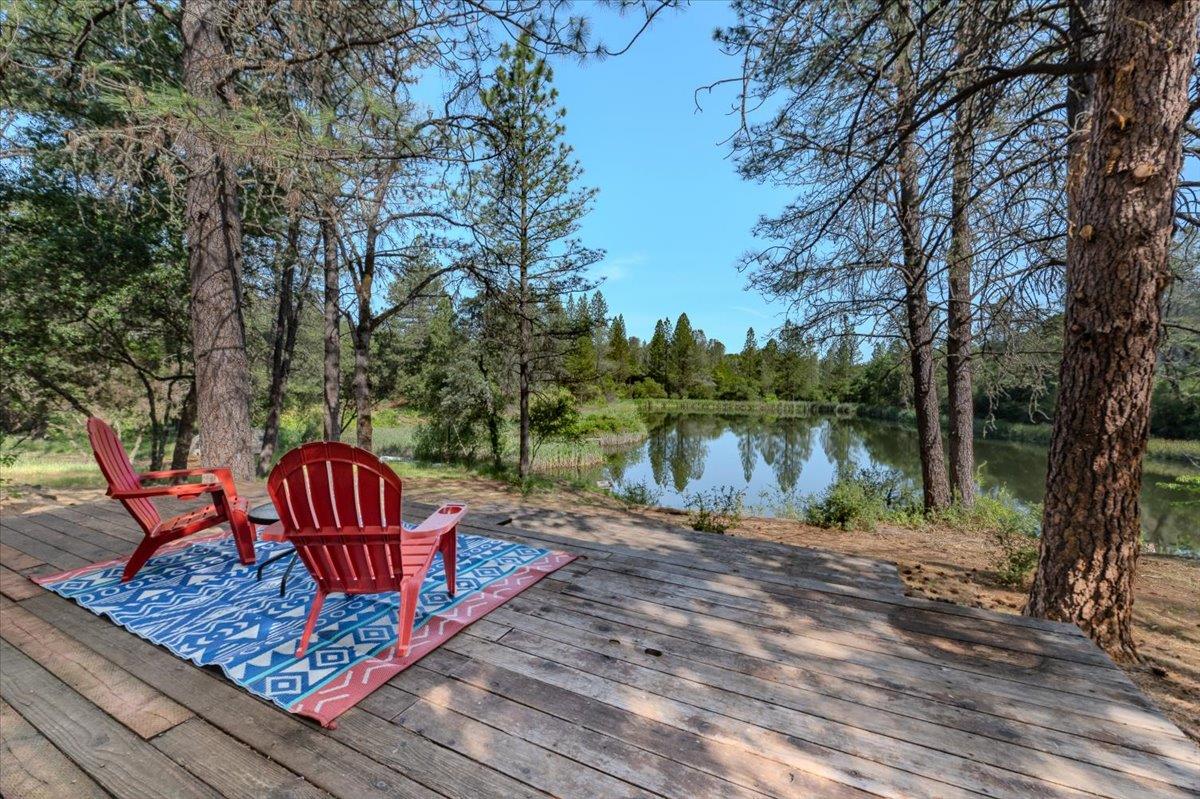 11076 Houghton Ranch Road Penn Valley, CA 95946 - Photo 20 of 41 a view of a bench on a lake