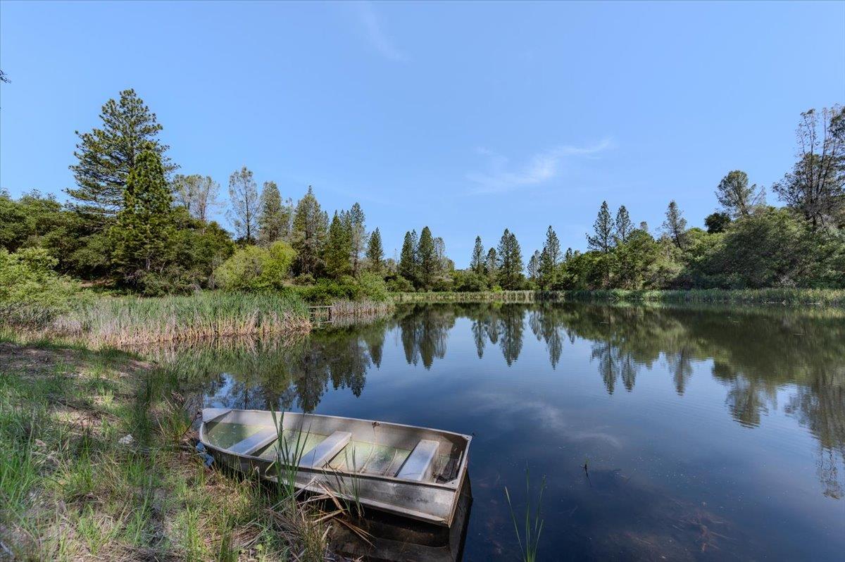 11076 Houghton Ranch Road Penn Valley, CA 95946 - Photo 2 of 41 a lake view with a city skyline in the background