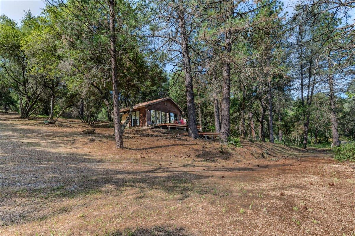 11076 Houghton Ranch Road Penn Valley, CA 95946 - Photo 21 of 41 a view of outdoor space with deck and trees