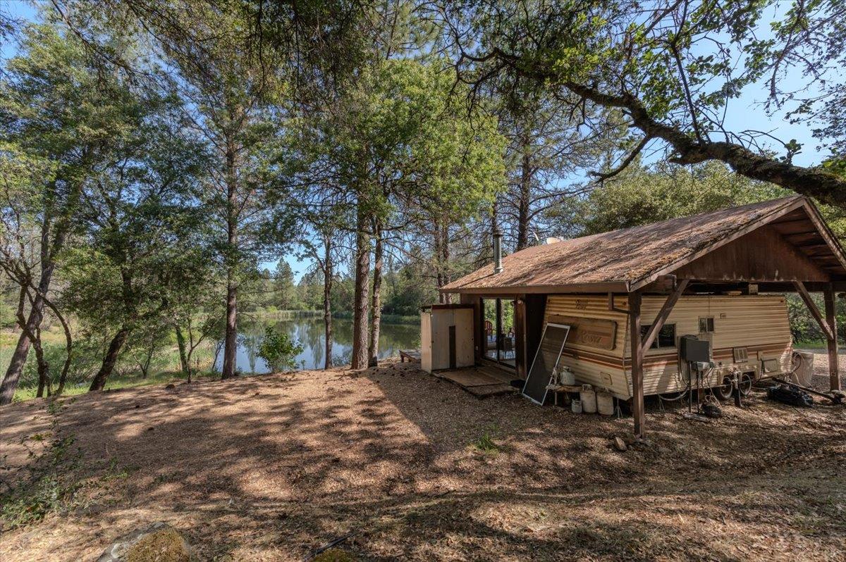11076 Houghton Ranch Road Penn Valley, CA 95946 - Photo 22 of 41 a view of a house with a yard