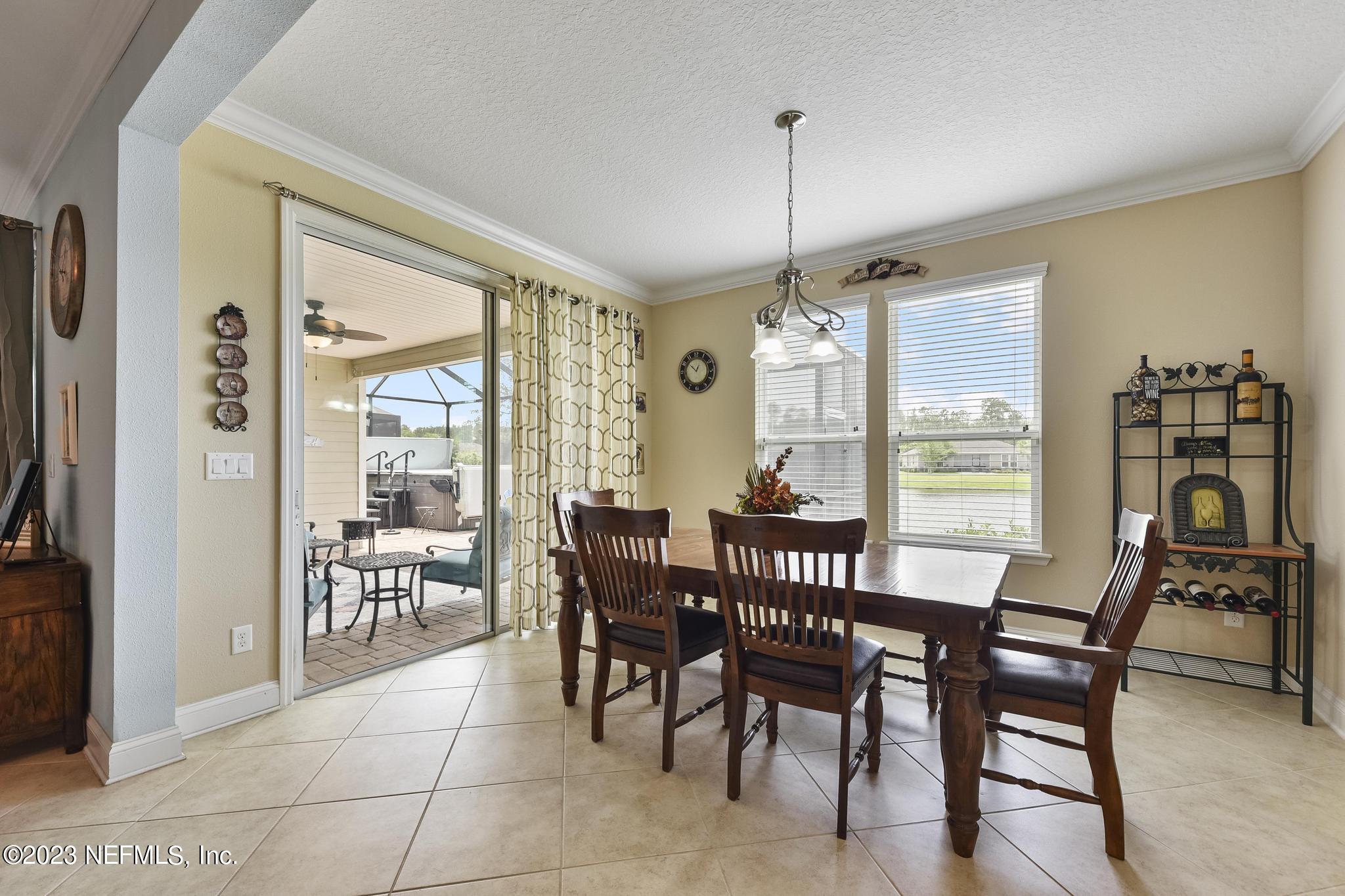 168 St Kitts Loop St. Augustine, FL 32092 - Photo 12 of 41 a view of a dining room with furniture window and outside view