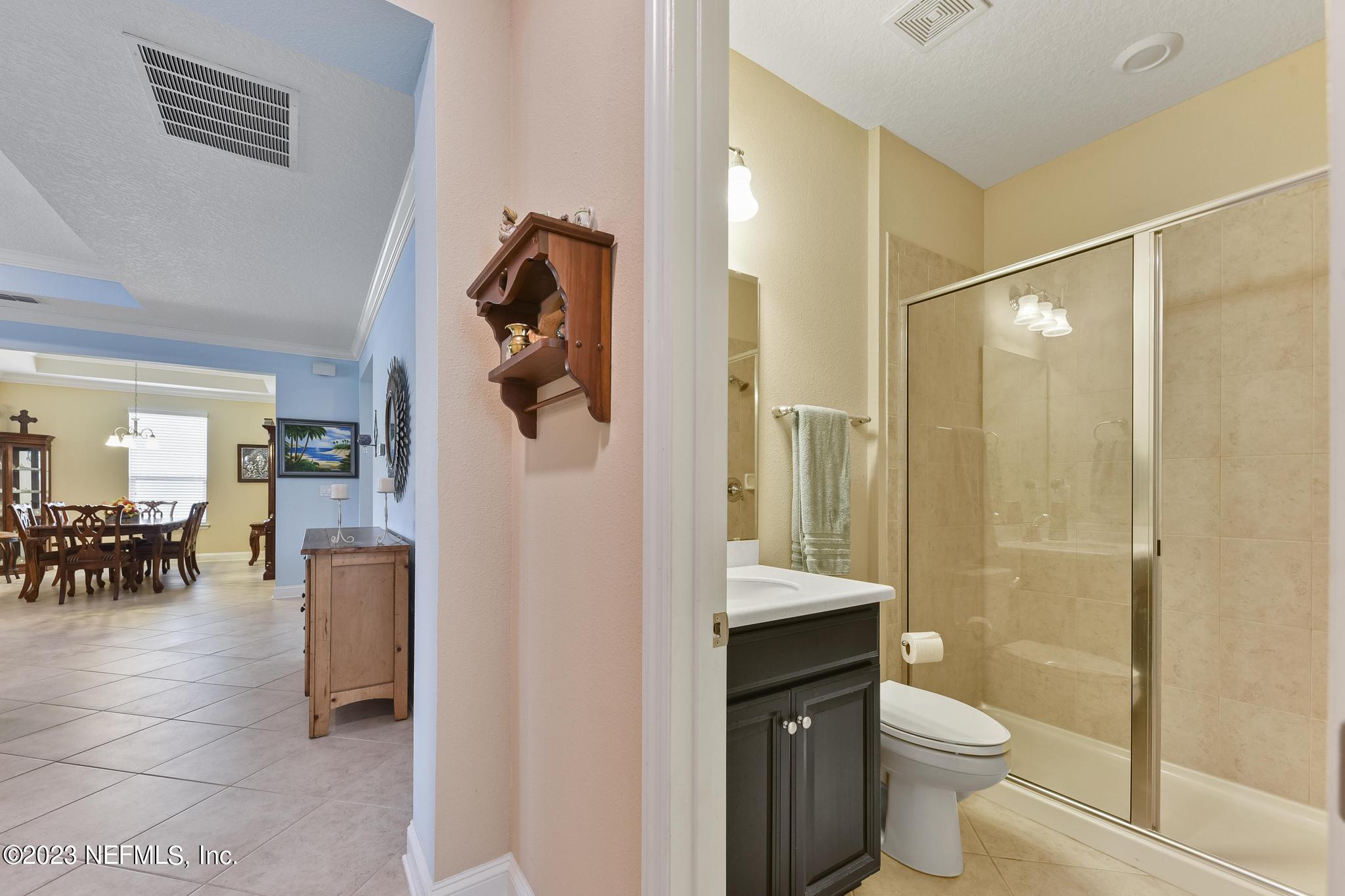 168 St Kitts Loop St. Augustine, FL 32092 - Photo 20 of 41 a bathroom with a toilet sink and shower
