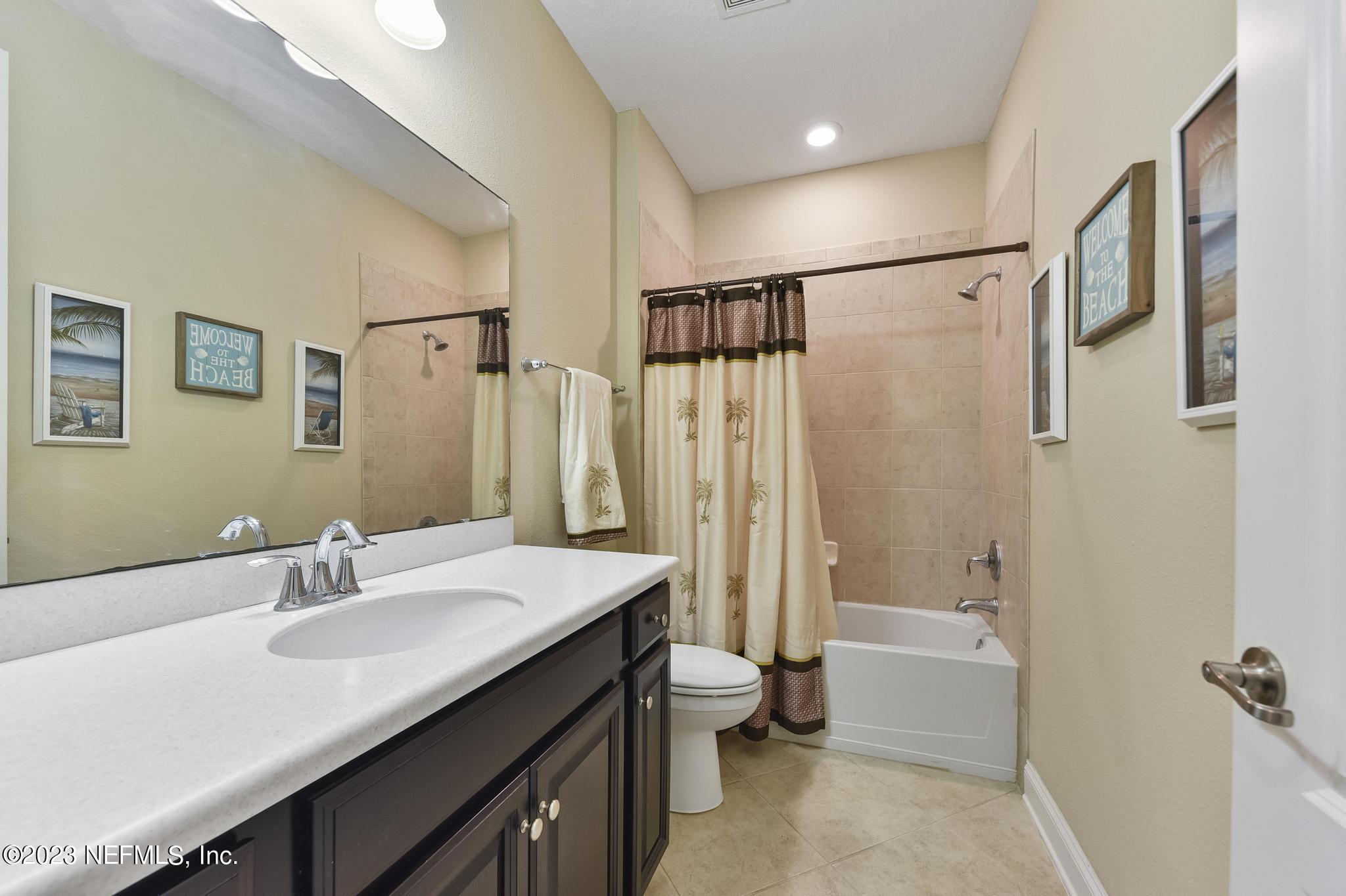 168 St Kitts Loop St. Augustine, FL 32092 - Photo 22 of 41 a bathroom with a sink double vanity mirror and a bathtub