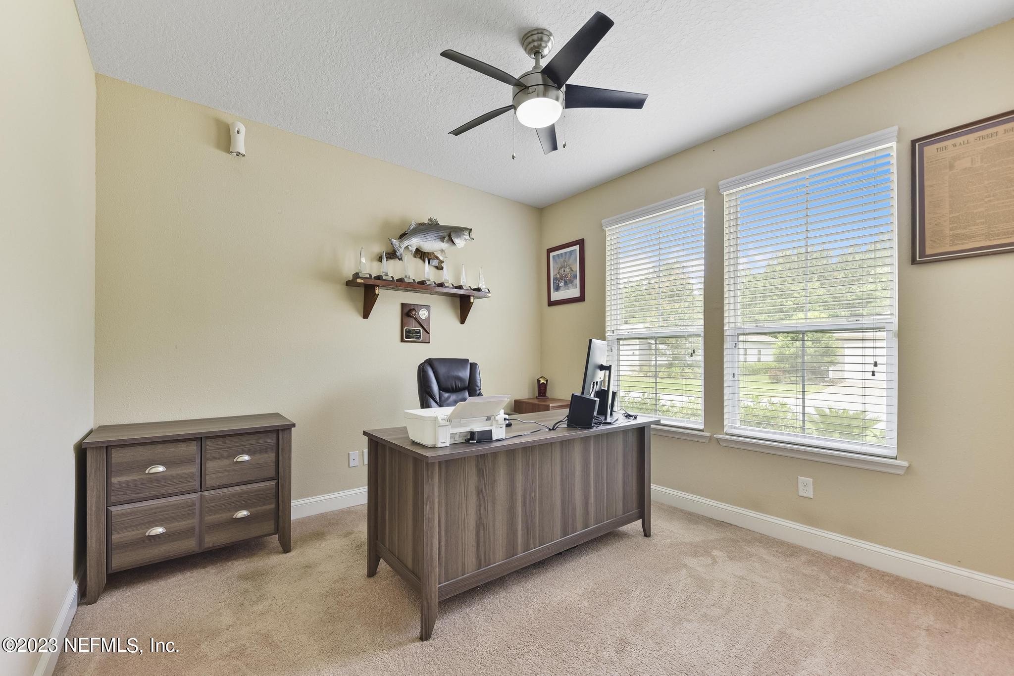 168 St Kitts Loop St. Augustine, FL 32092 - Photo 23 of 41 a living room with furniture and a window