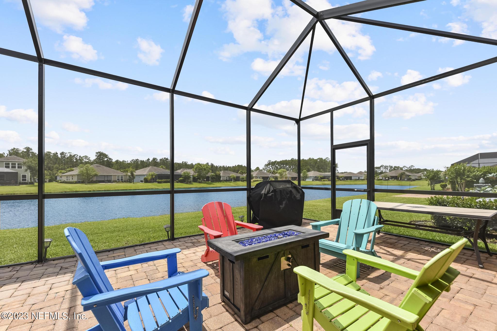 168 St Kitts Loop St. Augustine, FL 32092 - Photo 26 of 41 a roof deck with a couch and chairs