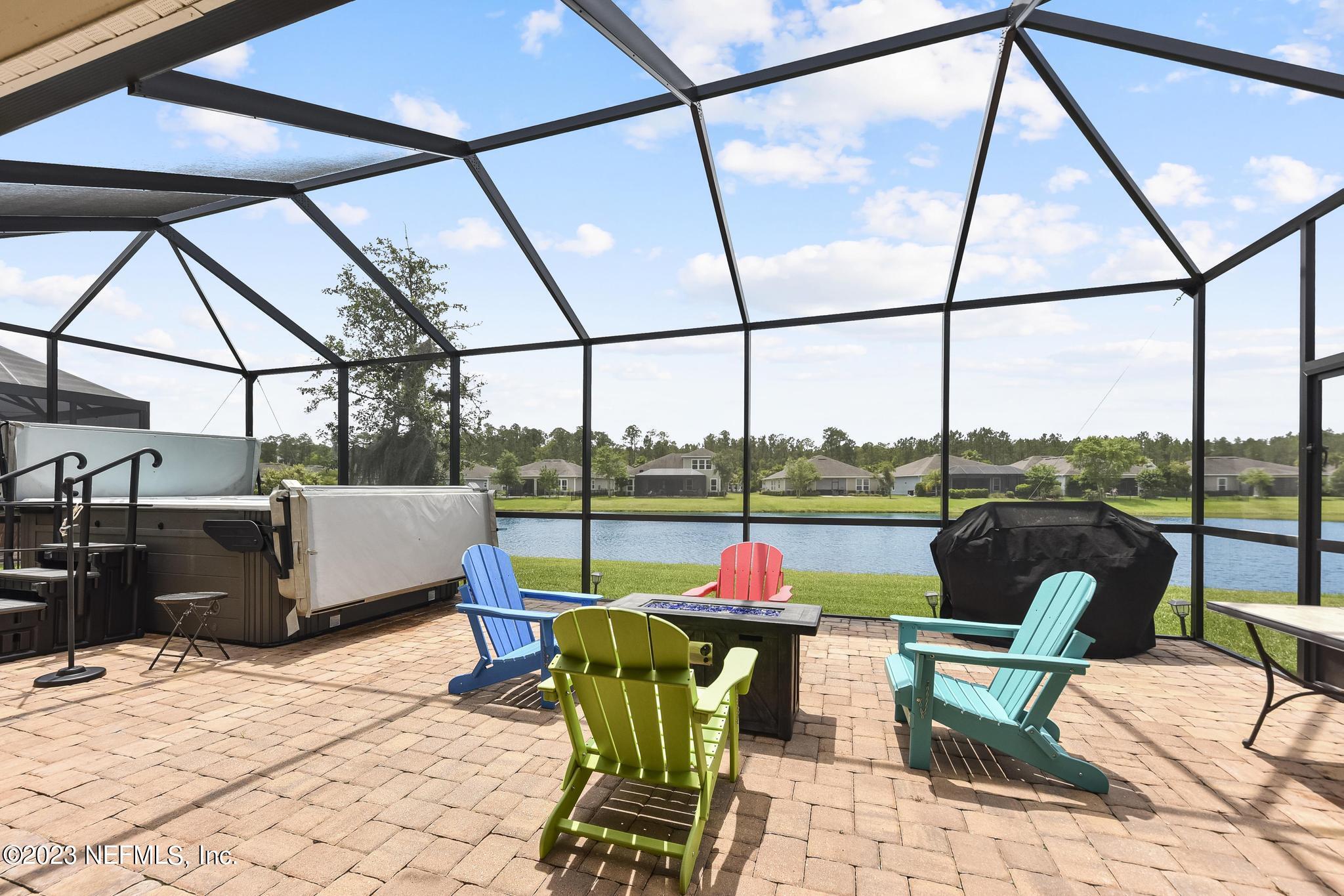 168 St Kitts Loop St. Augustine, FL 32092 - Photo 28 of 41 a view of a swimming pool with a lounge chairs
